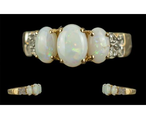 Ladies 9ct Gold Opal and Diamond Set Ring, Marked 9ct to Shank. The Opals of Good Colour with Diamond Shoulders. Ring Size L.