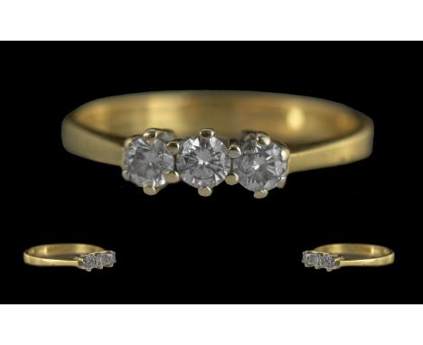 Ladies Pleasing 18ct Gold 3 Stone Diamond Set Ring - Marked 750 (18ct) to Interior Of Shank. The well Matched Round Faceted D