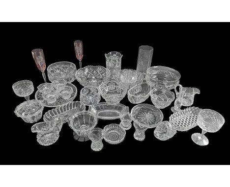 Large Collection of Cut Glass Items, to include various cut glass fruit and trifle bowls, vases, jugs, champagne flutes, asso