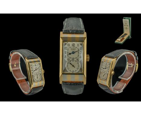 Rolex. A fine 18K striped white and yellow gold manual wind rectangular wristwatch Model: Prince 'Tiger Stripe' Reference: 13