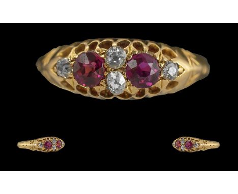 18ct Gold Antique Ladies Ring, set with two ruby coloured stones, between four diamond spacers.  Fully hallmarked for Chester
