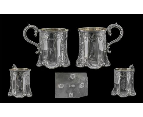 Mid Victorian Period 1837 - 1901 Pair of Sterling Silver Six Sided and Shaped Cups, With C Scroll Handles and Raised on Six P