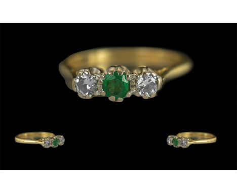 Ladies 18ct Gold Attractive 3 Stone Diamond and Emerald Set Ring. Full Hallmark to Interior of Shank. The Emerald and Diamond