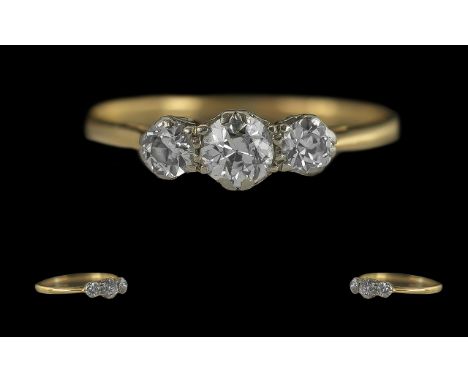 Ladies 18ct Gold 3 Stone Diamond Set Ring, marked 18ct and platinum to interior of shank, circa 1920s, the trio of round face