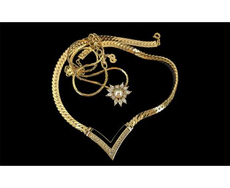 Christian Dior, two ladies pendants, comprising a crystal and pearl flower design on a box chain, and a v-shaped pendant set 