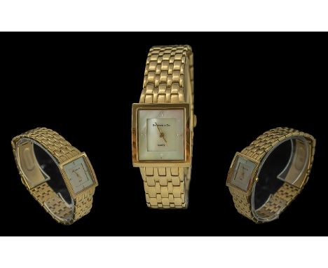 Diamond &amp; Co. Ladies Wristwatch, gold tone bracelet strap, mother of pearl face, diamond markers at 12, 3, 6 and 9.  Boxe