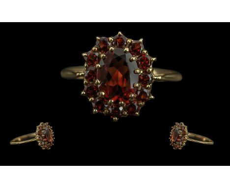 Ladies Attractive 9ct Gold Garnet Set Cluster Ring, full hallmark to interior of shank, the well matched fire garnets of plea