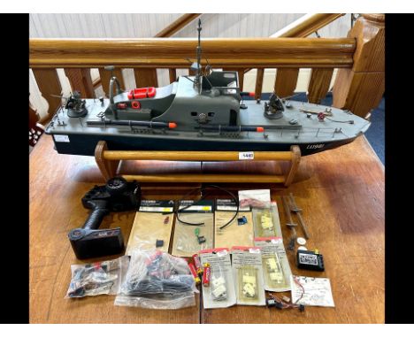 Model Torpedo Boat, Radio Controlled, with control unit and spare parts, and stand.  Measures 37'' long, height 12'', unteste