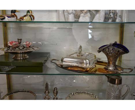 A collection including; a silver plated plate from Harrods with box, a candlestick with flower arranged basket around it, a s