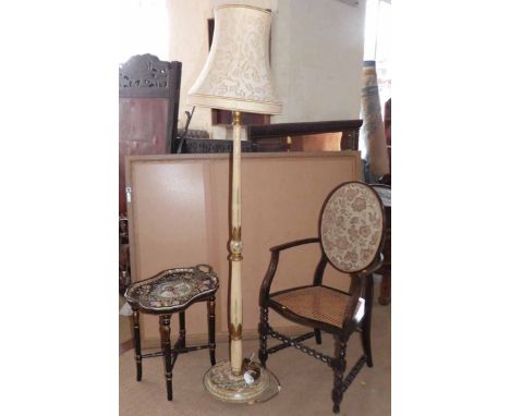 Ebonised elbow chair with cane back standard lamp complete with shade and ebonised / gilt ceramic tray top table. Condition r