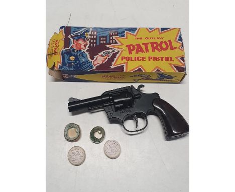 A boxed vintage "The Outlaw Patrol Police Pistol" 