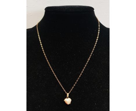 A 9ct Gold chain and pendant. 1.93g 