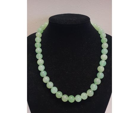 A green bead necklace possible Jade? 