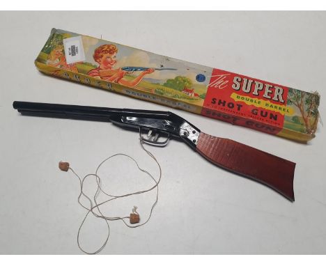 A boxed vintage pop gun "The Super Double Barrel Shotgun" 