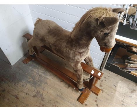 A vintage rocking horse on base. Shipping unavailable 