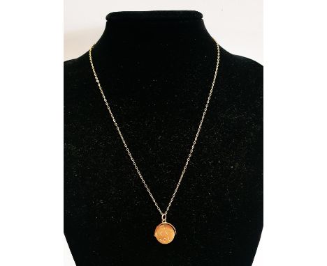 A 9ct Gold chain and pendant. 2.18g 