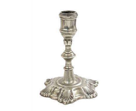 An 18th Century candlestick, possibly Paktong, ball knop with six petals, on a hexagonal base with shell shaped corners, stan