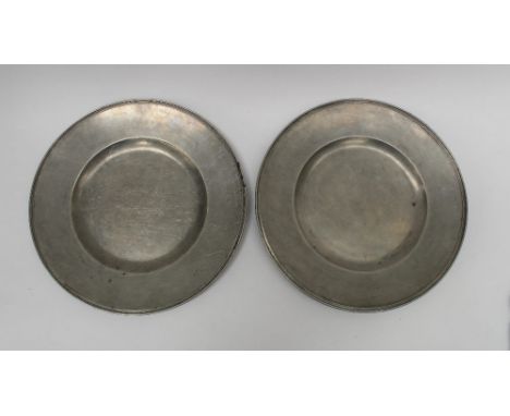 A pair of multi-reeded broad rim pewter plates, 10inch diameter, (rim ratio 36.7%) by Jaques Taudin III of St Martin in the F