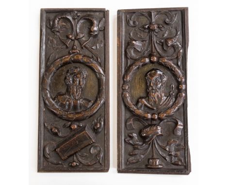 A 16th Century pair of carved Romayne portrait panels, two possibly eminent public male scholars set in carved Roman laurel w