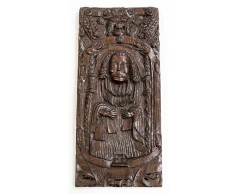 A folk art rendition of a 16th Century carved West Country priest sat in a grand confession chair with grotesque beast carved