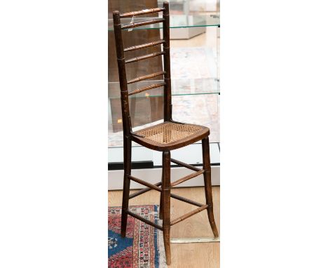 A 19th century elm cane seated high chair, with bamboo effect ladder back, approx 100cms high