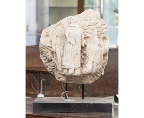 Two Medieval limestone architectural fragments, each carved in high relief with figures, largest 35cm by 33cm, one mounted on