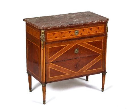A LATE 19TH-CENTURY FRENCH TRANSITIONAL STYLE MARBLE TOP COMMODEWith gilt-metal mounted inlaid Kingwood three drawer base on 