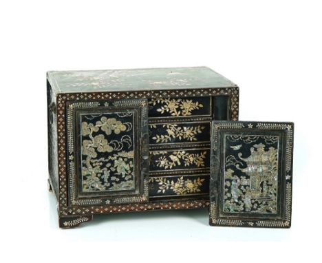 A CHINESE-EXPORT MOTHER-OF-PEARL INLAID LACQUER TABLE CABINETLate 19th CenturyThe panelled doors decorated with a pagoda, fig