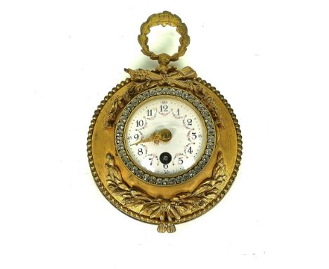 A FRENCH ORMOLU SMALL HANGING TIMEPIECEEarly 20th CenturyThe glazed door with a paste set bezel, painted white enamel dial, i