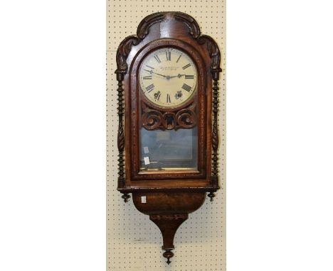 A late 19th century American walnut and inlaid wall clock, having a two train movement. Losses, h96cm