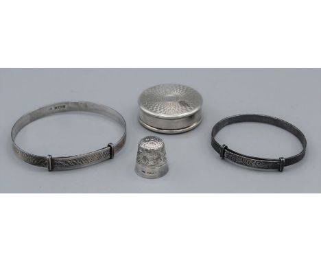 A selection of silver items, an engine turned sterling silver pill box, a sterling silver thimble and two silver Christening 