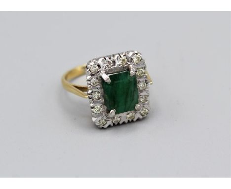 An emerald and diamond cluster ring in yellow and white metal, size Q, approx 6.5gm in vintage case, emerald requires attenti