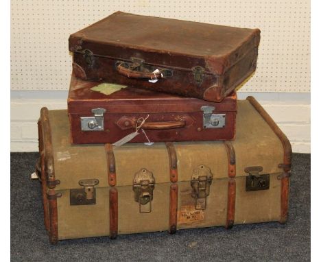 Four various vintage brown leather suitcases and a wooden bound travelling trunk