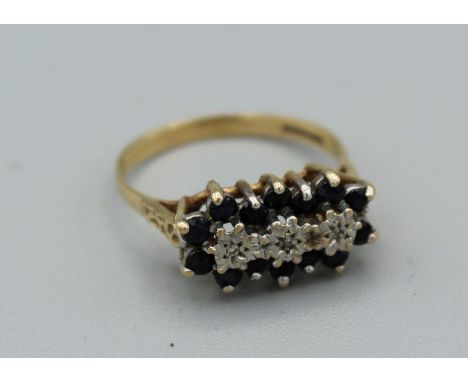 A 9ct gold sapphire and diamond East to West cluster ring. Gross weight approx 2.5gm, size N