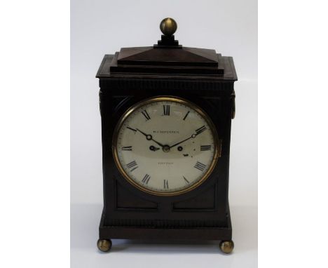 A late George III mahogany cased mantel clock, having a later brass eight day two train movement striking on a gong, the face