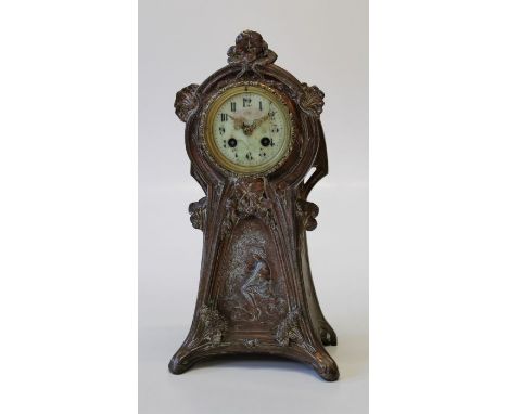 An Art Nouveau French copper patinated spelter mantle clock, the case with figural and floral panels enclosing an eight day b