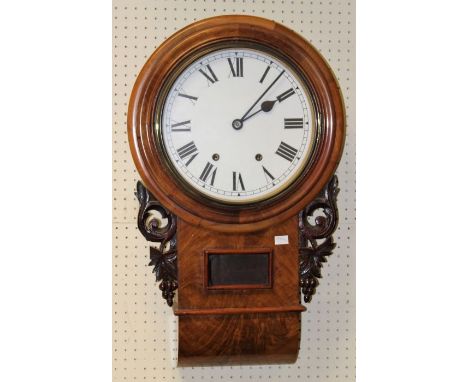 A late 19th century American drop dial walnut wall clock having a two train movement and enamel dial, h69cm