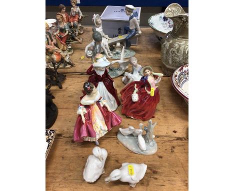 Three Royal Doulton figures, three pieces of Lladro and three Nao ducks