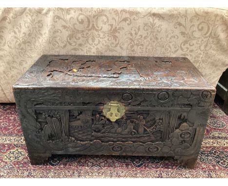 Chinese camphorwood trunk with carved decoration, 88cm wide, 42cm deep, 49cm high