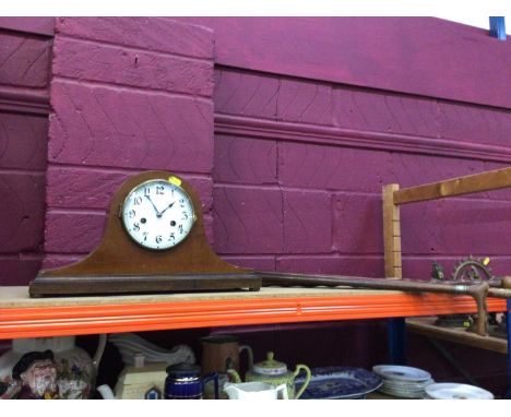 Four walking sticks with horn handles, and a mantel clock
