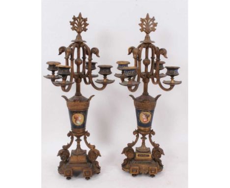 Pair of 19th century Continental gilt metal and painted porcelain four branch candlesticks, with scrolling candle arms and po