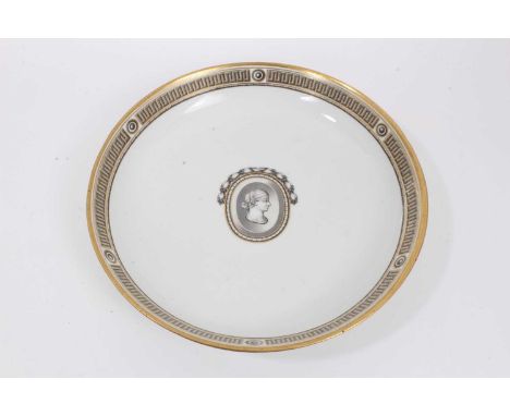 A Vienna round dish, in Neoclassical style, circa 1780, decorated en grisaille with Greek Key border and central profile port