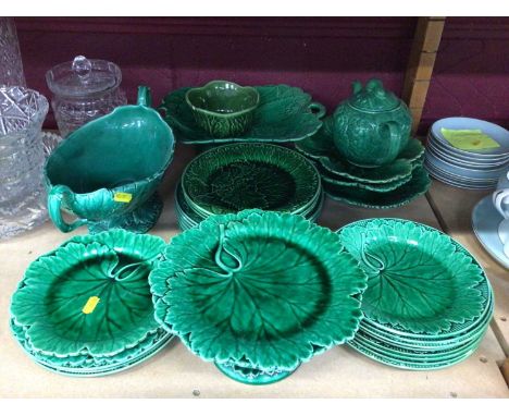 A group of Wedgwood and other green majolica, including dishes, tazza, teapot, etc6 items are damaged, please see additional 