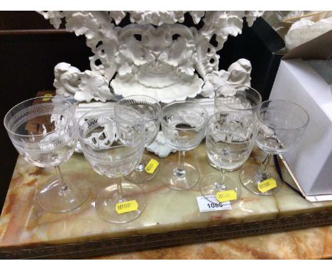 A group of Victorian and Edwardian drinking glasses, some etched with a Greek Key pattern, and an Edwardian inlaid mantel clo