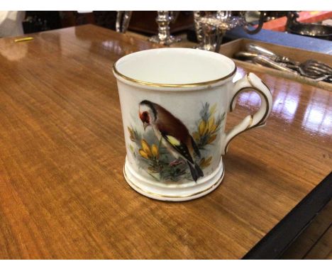 A Royal Worcester cup painted with a goldfinch by W. Powell