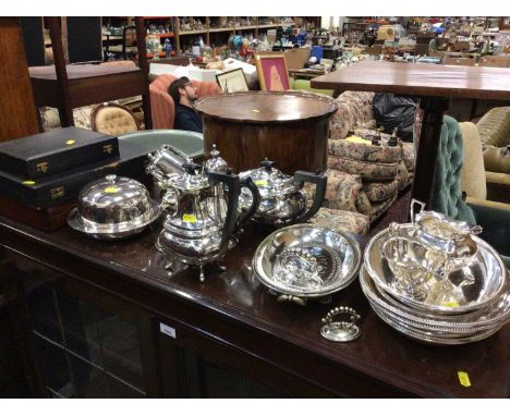 Group of silver plate, including two coffee pots, a teapot, serving dishes, etc