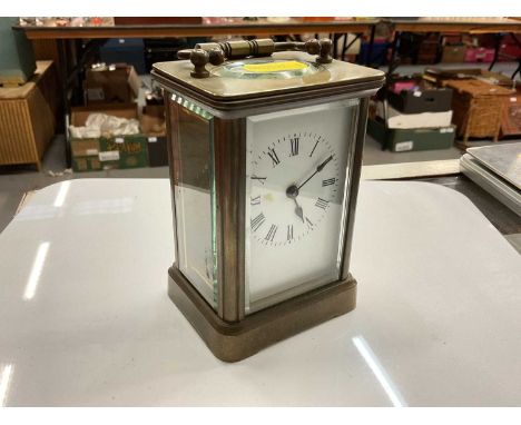 French brass carriage clock with white enamel dial