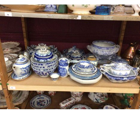 Group of blue and white china, mostly 19th century English transferware, including Miles Mason (one shelf)
