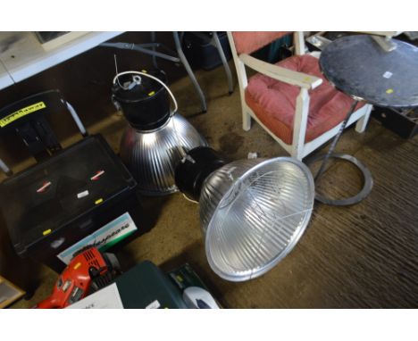Two large industrial light fittings