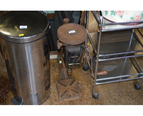 A bench mounted hand powered pillar drill